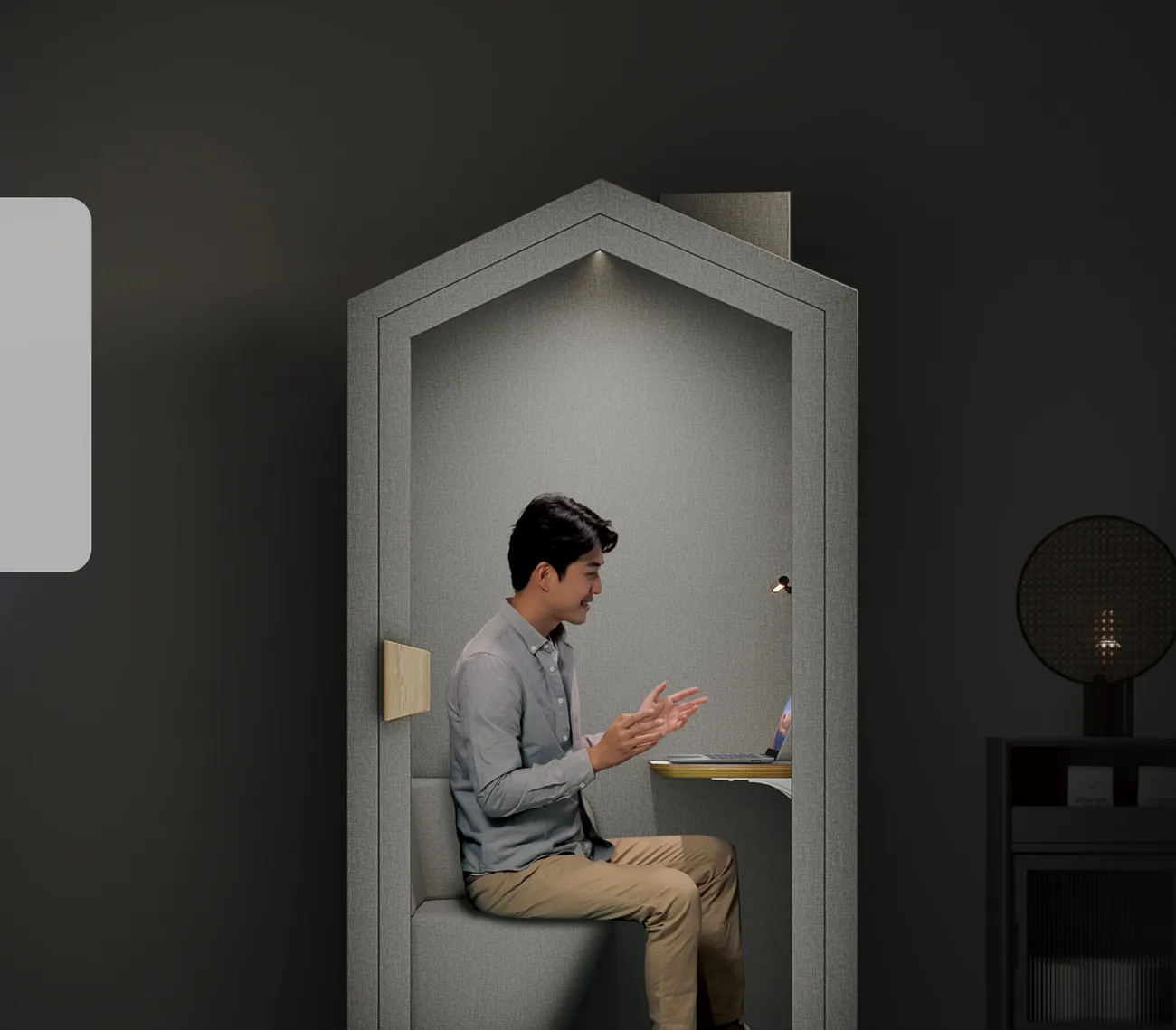 Man working late inside the SonicHive Home Pod at night